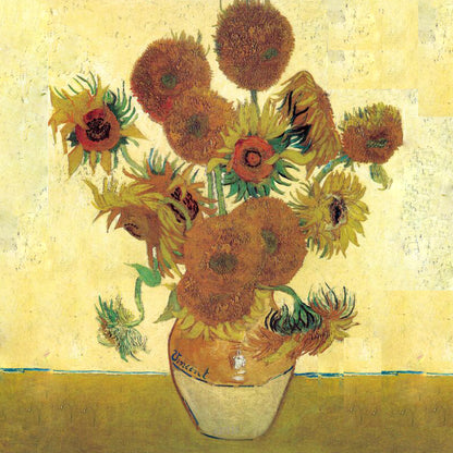 Ochre and yellow sunflowers with green stems in a pale yellow vase on an ochre table against yellow.