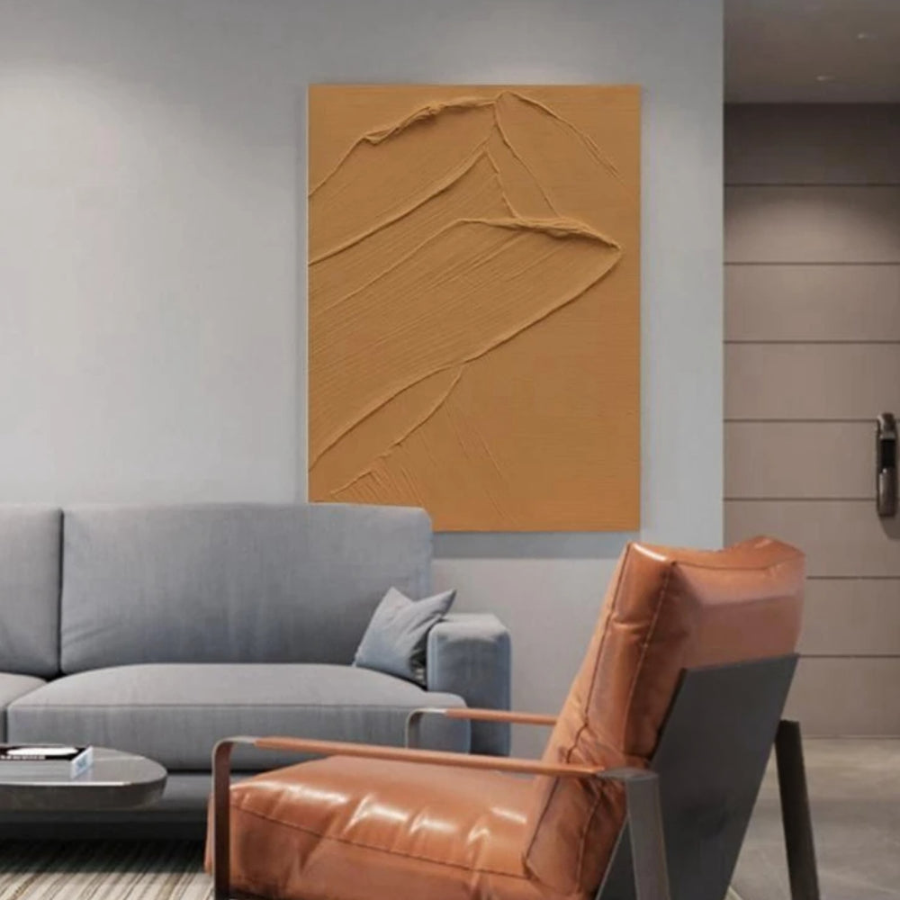Room mockup showing ochre textured abstract with a raised sweeping ridge and fine diagonal grooves.