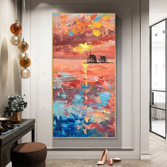 Room mockup showing orange and pink sunset above turquoise water with a bright reflection and small dark pier structures.