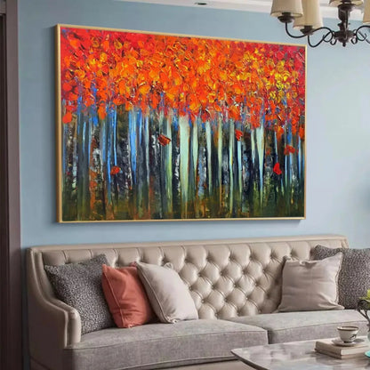 Room mockup showing dense orange and red autumn foliage above slender pale blue and dark tree trunks against a deep green forest floor.