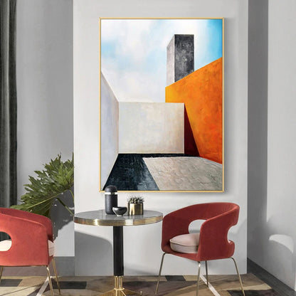 Room mockup. Angular white architectural blocks beside an orange wall and dark tower, with pale blue sky and sharp shadows.