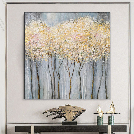 Room mockup. Fine dark trunks support pale pink and white textured foliage against a cool grey background.