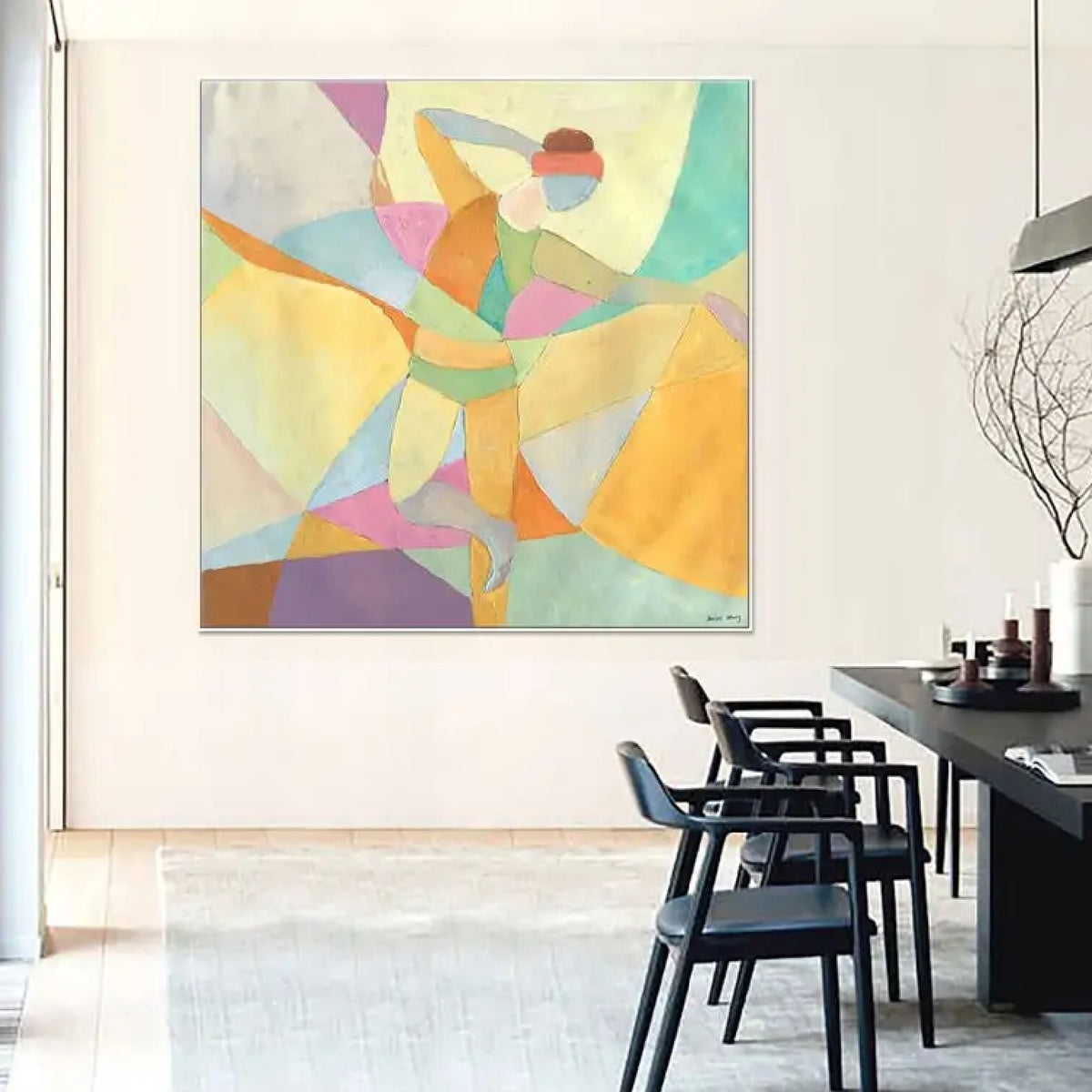 Room mockup. A dancer with one arm raised and one leg extended, formed from pastel yellow, mint, pink and blue geometric shapes.