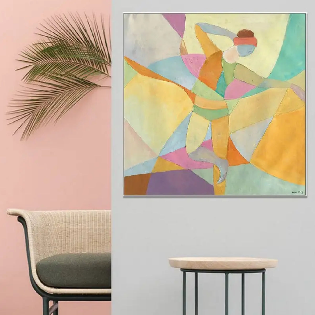 Room mockup. A dancer with one arm raised and one leg extended, formed from pastel yellow, mint, pink and blue geometric shapes.