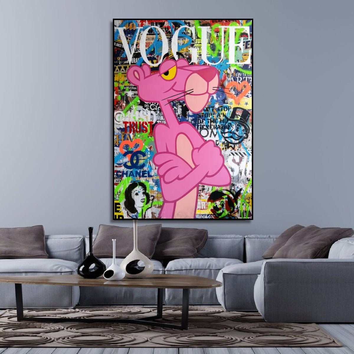 Room mockup showing pink Panther with crossed arms against a dense green, blue and orange graffiti collage beneath white Vogue lettering.