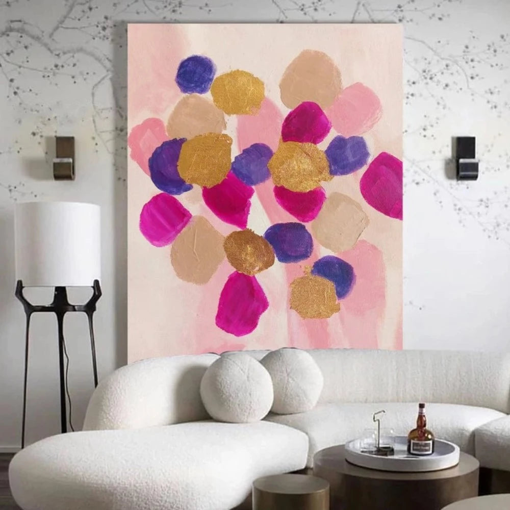 Room mockup showing rounded pink, magenta, purple and gold-coloured patches clustered over a pale blush background.