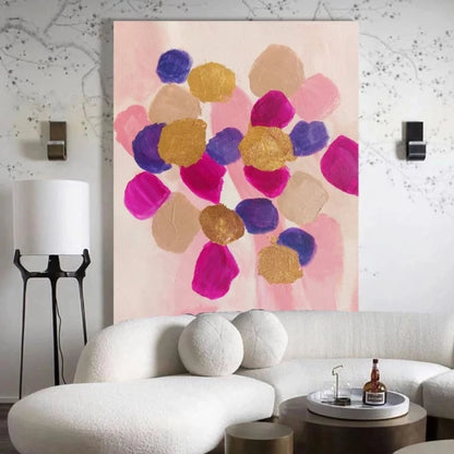Room mockup showing rounded pink, magenta, purple and gold-coloured patches clustered over a pale blush background.