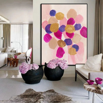 Room mockup showing rounded pink, magenta, purple and gold-coloured patches clustered over a pale blush background.