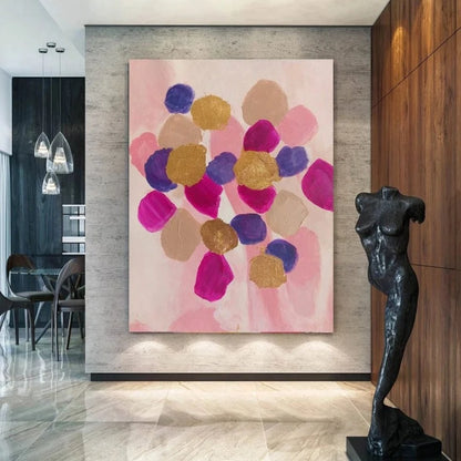 Room mockup showing rounded pink, magenta, purple and gold-coloured patches clustered over a pale blush background.