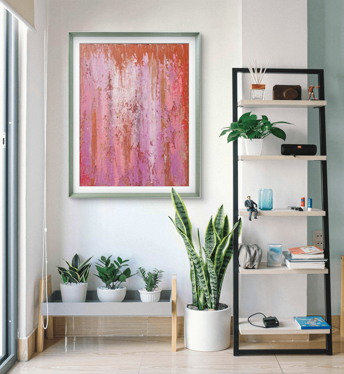 Room mockup showing pink and purple abstract painting with fine vertical drips, red accents and a narrow orange upper band.