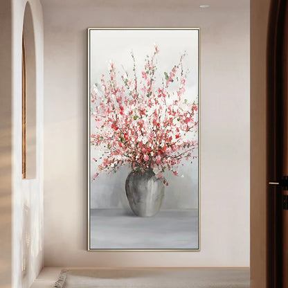 Room mockup showing tall spray of pink and white blossoms in a rounded grey vase against a pale grey background.