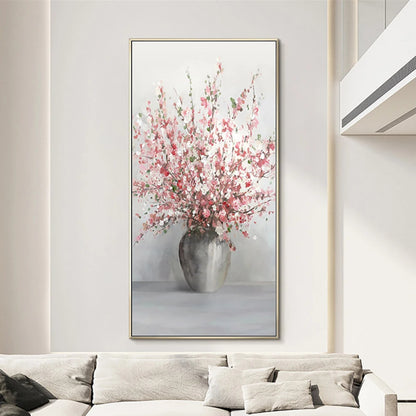 Room mockup showing tall spray of pink and white blossoms in a rounded grey vase against a pale grey background.