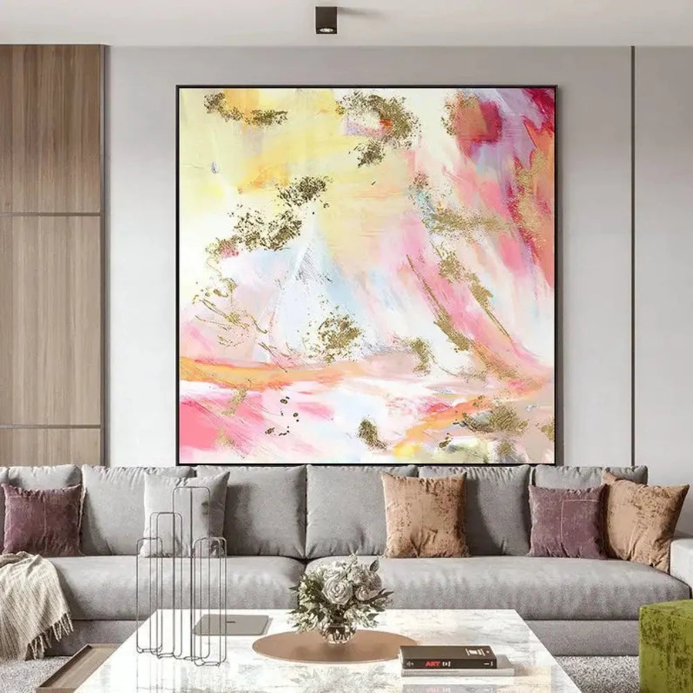 Room mockup showing soft pink, pale yellow and white abstract washes with curved marks and scattered gold-coloured patches.