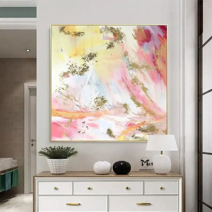 Room mockup showing soft pink, pale yellow and white abstract washes with curved marks and scattered gold-coloured patches.