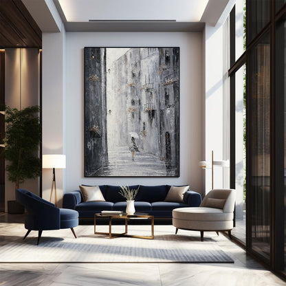 Modern living room with a large abstract painting on the wall, blue sofa, and armchair.