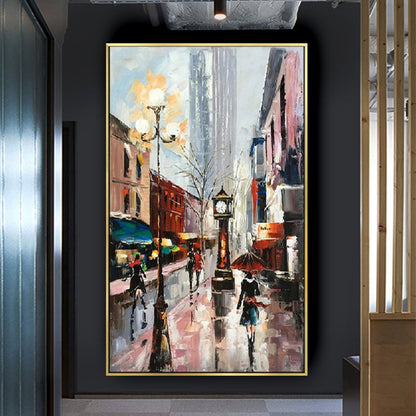 Room mockup. Rainy street with a tall clock, glowing streetlamp and umbrella-carrying figures among red buildings and grey reflections.