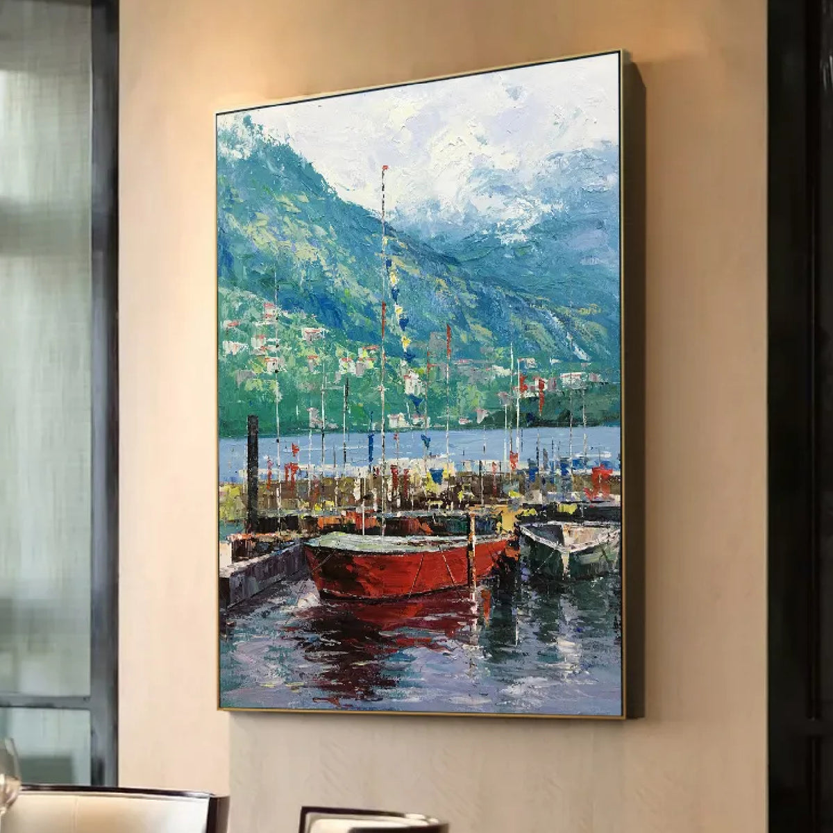 Room mockup. Red boats with fine masts float on dark blue water beneath green mountains and a pale clouded sky.