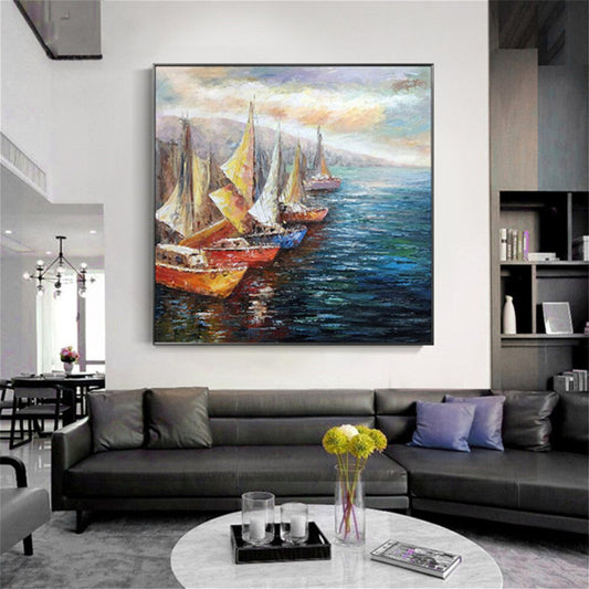 Room mockup. Red-hulled boats with yellow and cream sails line blue water, with distant sails beneath a pale sky.