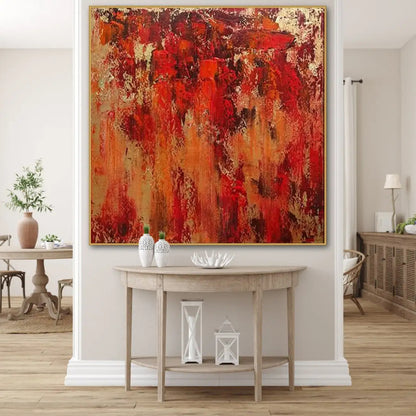 Room mockup. Layered red, rust-orange and ochre patches with dark scuffed marks and pale gold-coloured textured areas.
