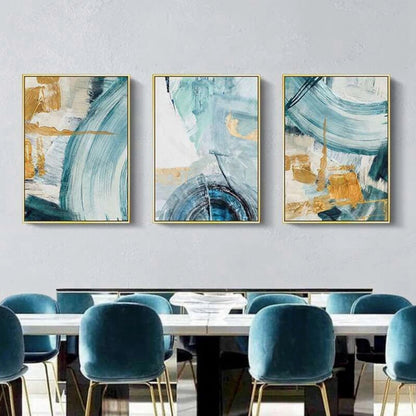 Room mockup showing three abstracts with sweeping teal and pale blue arcs over cream fields with gold-coloured geometric accents.