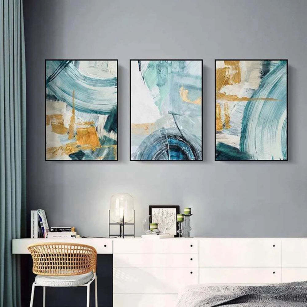 Room mockup showing three abstracts with sweeping teal and pale blue arcs over cream fields with gold-coloured geometric accents.