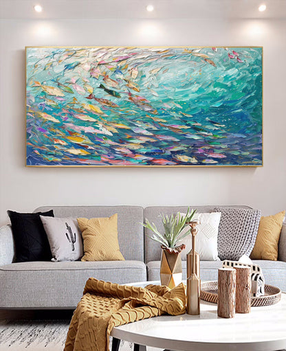 Large abstract painting above a gray sofa in a living room.