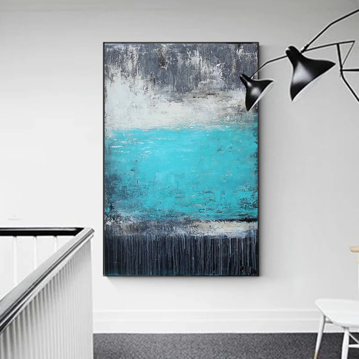 Room mockup. A bright turquoise central field lies between mottled grey upper marks and a dark lower band with fine drips.