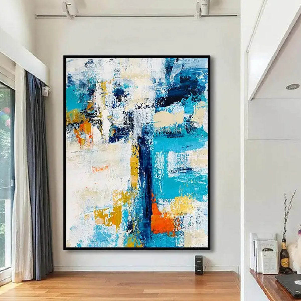 Room mockup. Broad turquoise and navy angular strokes cross a textured white field with orange and yellow patches.
