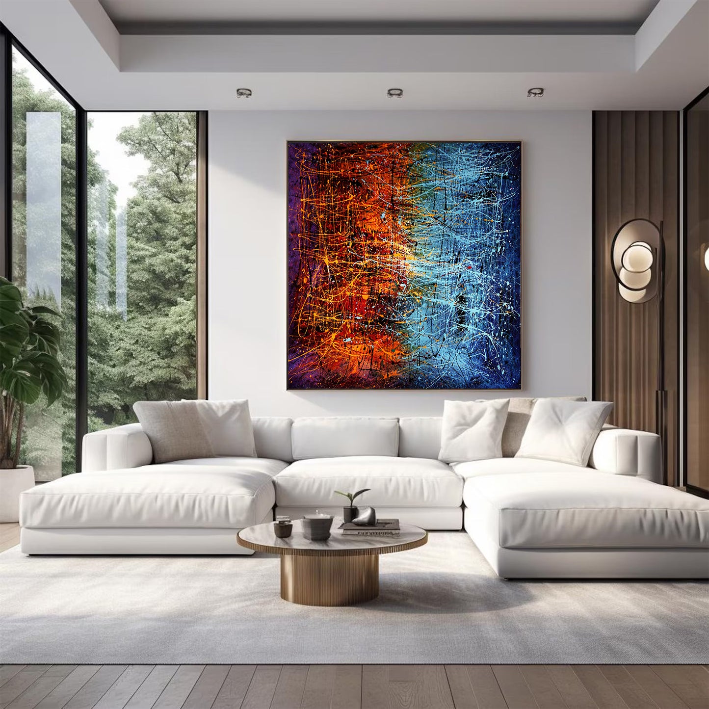 Vertical abstract expressionist artwork in orange and blue tones hanging above a white sectional sofa in a contemporary living room.