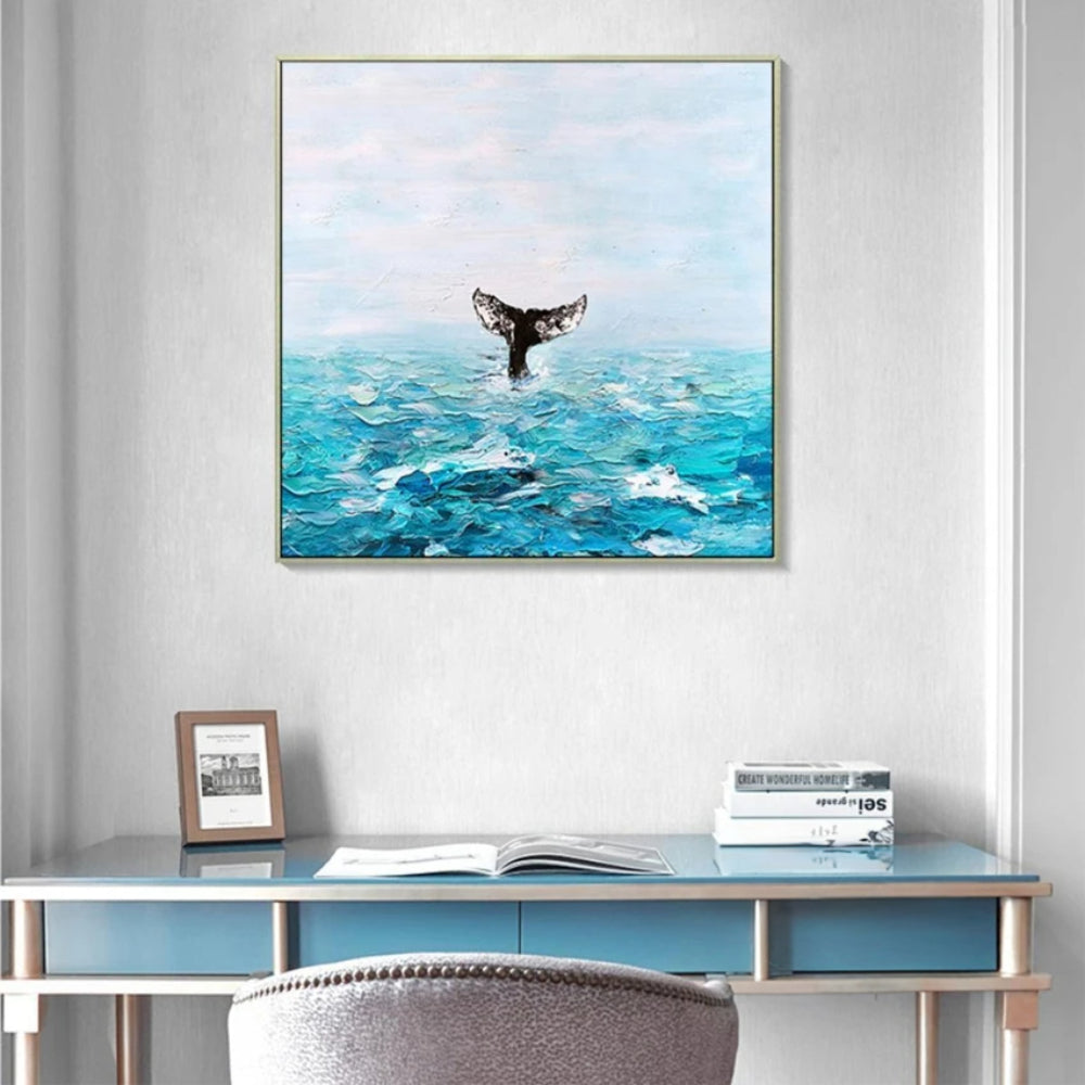 Room mockup showing dark whale tail rising above textured turquoise waves beneath a pale blue sky.