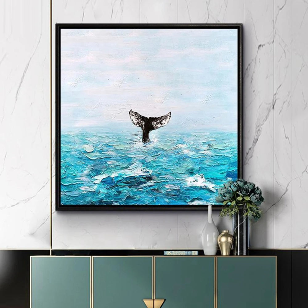 Room mockup showing dark whale tail rising above textured turquoise waves beneath a pale blue sky.