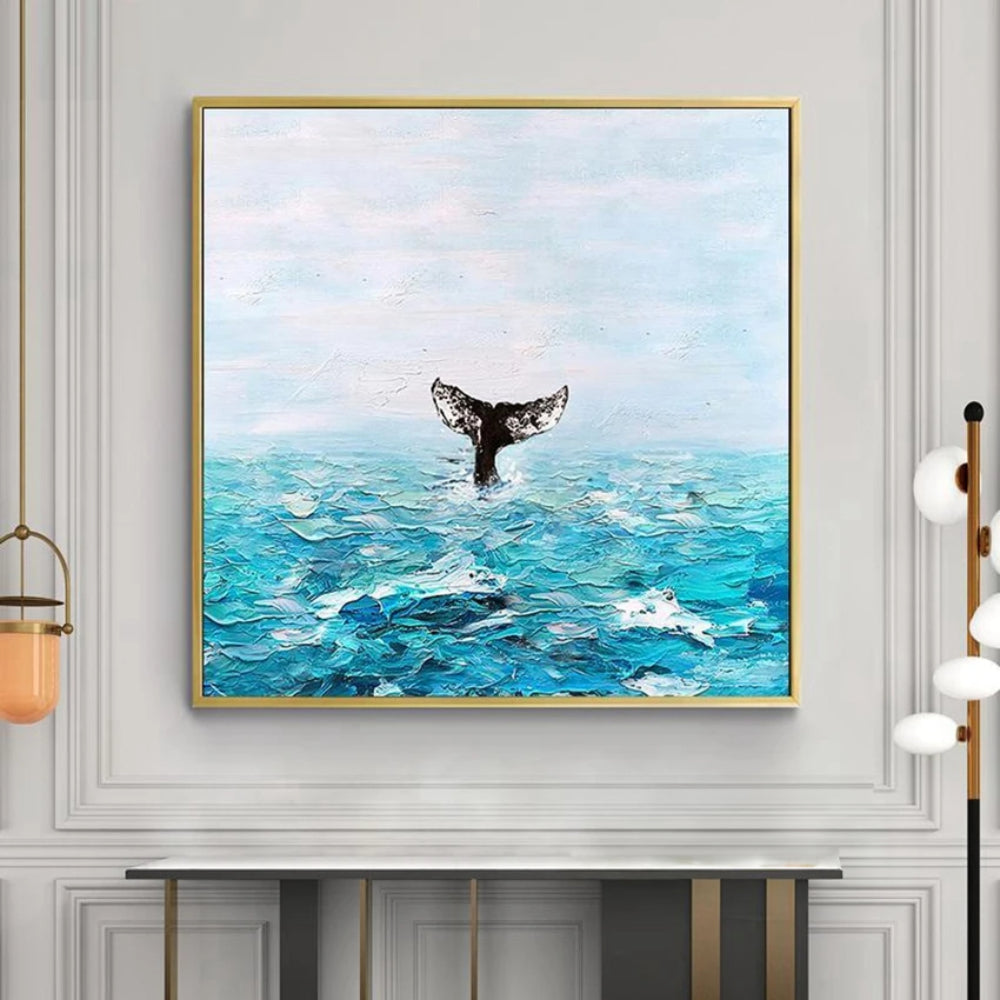 Room mockup showing dark whale tail rising above textured turquoise waves beneath a pale blue sky.
