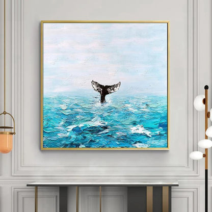 Room mockup showing dark whale tail rising above textured turquoise waves beneath a pale blue sky.