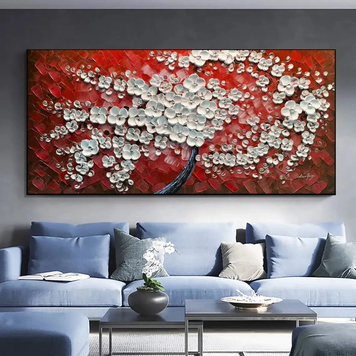 Room mockup showing dense white textured blossoms on a dark branching trunk against a bold red and burgundy background.
