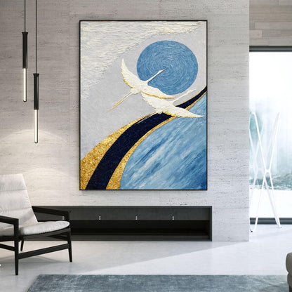 Abstract painting with birds and blue circle on a wall in a modern living room.