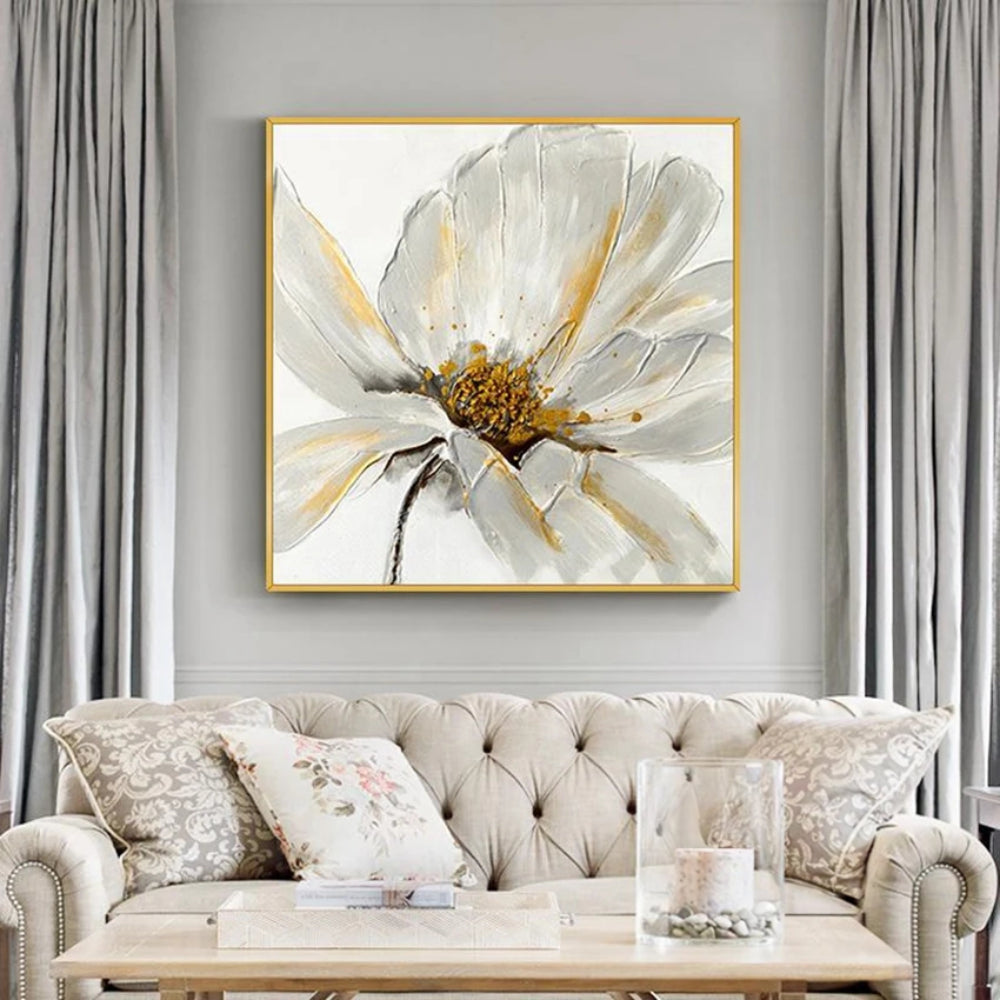 Room mockup showing large white flower with layered petals, fine grey outlines and a gold-coloured centre on a pale background.
