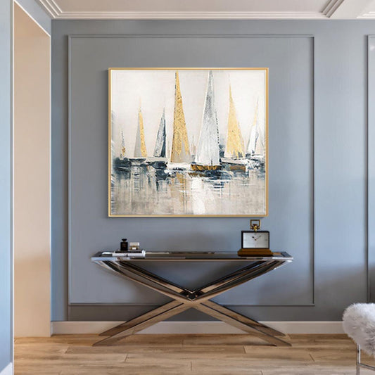 Room mockup. Tall white, grey and gold-coloured sails above dark hulls and pale grey reflections.