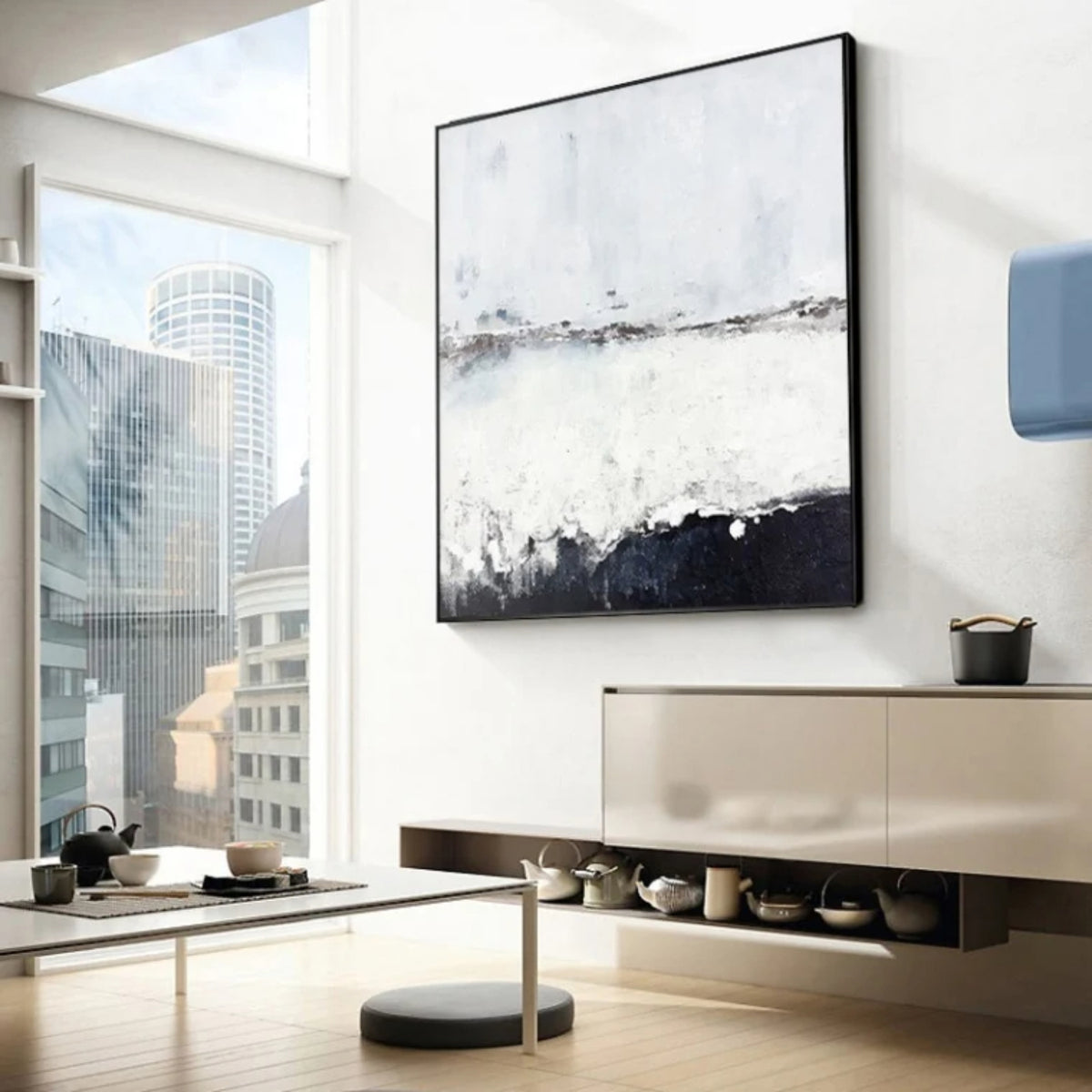 Room mockup. A pale white and grey field with a fine broken horizon and a rough dark charcoal band rising along the bottom.