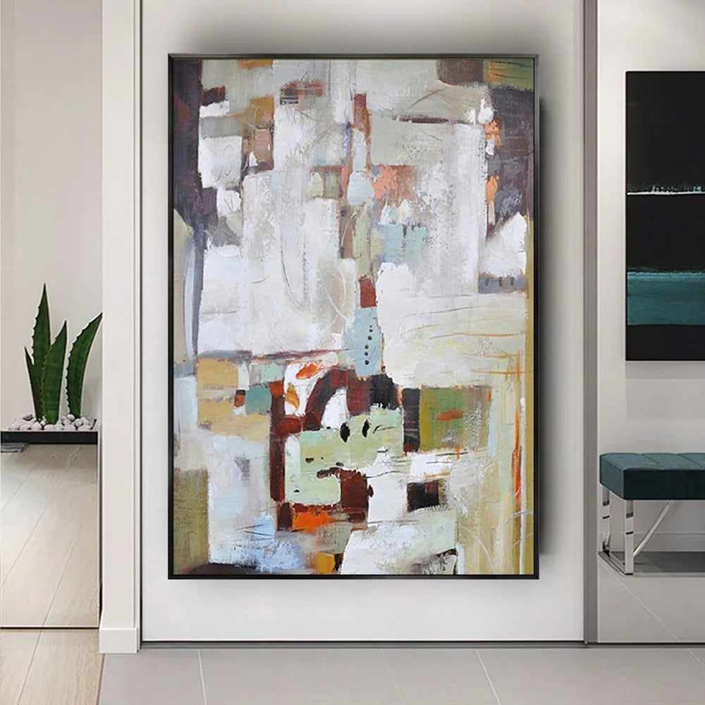 Room mockup showing white and grey abstract blocks above a cluster of brown, pale green, black and muted orange shapes.