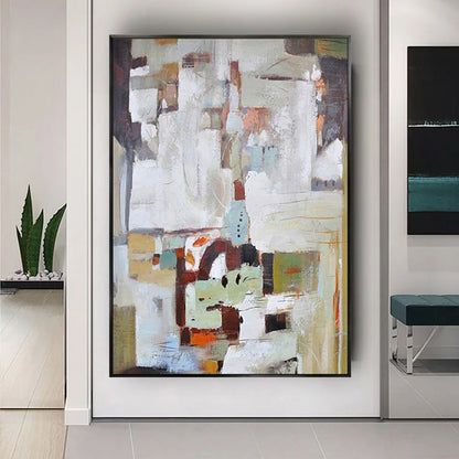 Room mockup showing white and grey abstract blocks above a cluster of brown, pale green, black and muted orange shapes.