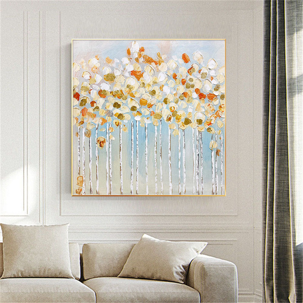 Room mockup. White and orange rounded blossom-like dabs crown fine pale trunks against a soft blue-grey background.