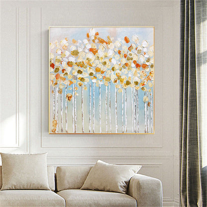 Room mockup. White and orange rounded blossom-like dabs crown fine pale trunks against a soft blue-grey background.