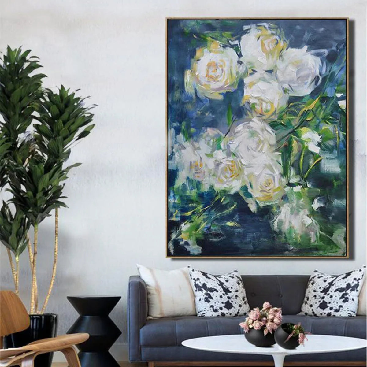 Room mockup. Loose white and pale yellow roses with green leaves against a deep blue and green background.