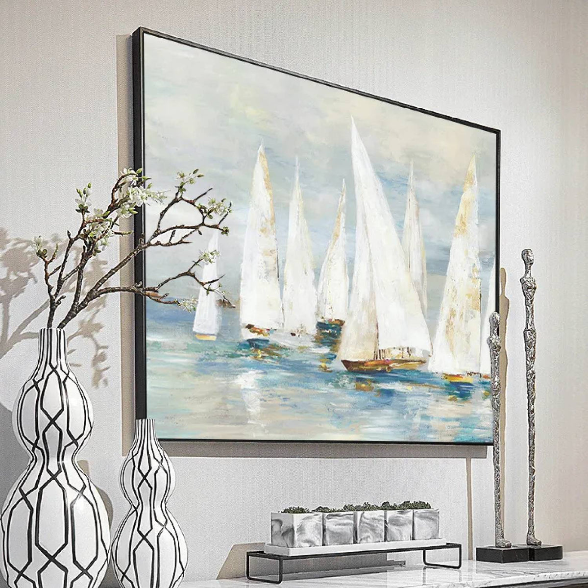 Room mockup. White-sailed boats with small ochre hulls across soft blue-grey water beneath a pale grey sky.