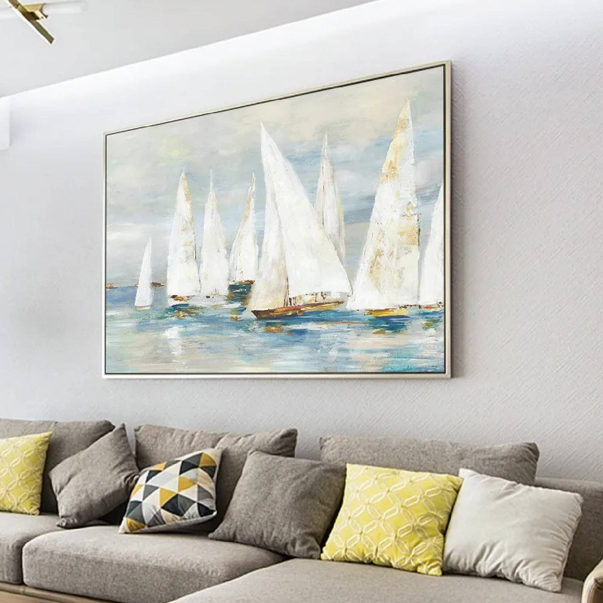 Room mockup. White-sailed boats with small ochre hulls across soft blue-grey water beneath a pale grey sky.