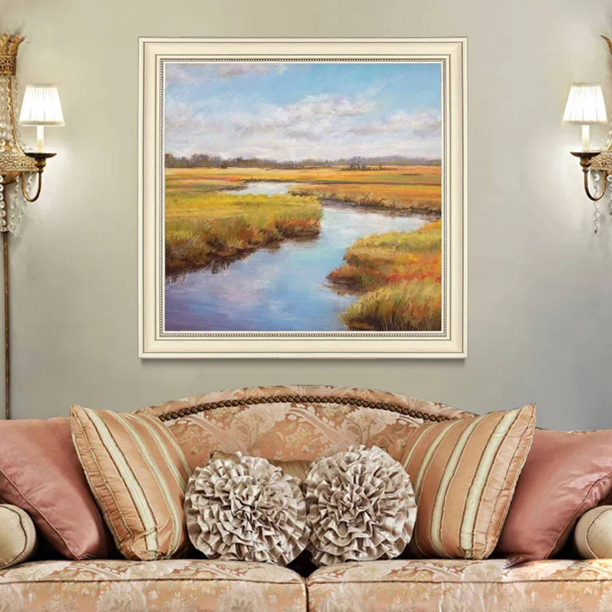 Room mockup. A winding blue stream runs through ochre and green marsh grasses beneath a pale blue sky with soft white clouds.