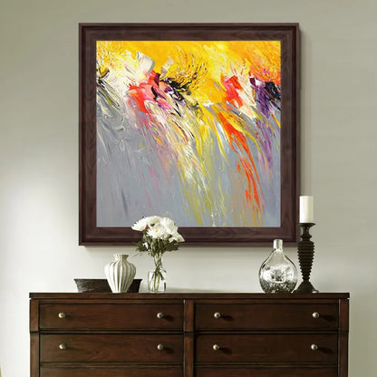 Room mockup. Bright yellow upper strokes blend into grey below, with pink, white and black accents trailing downward.