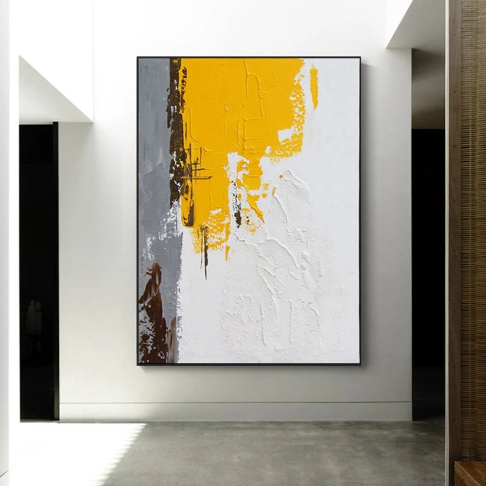 Room mockup showing textured white abstract with a large mustard yellow upper block and narrow grey and brown marks along the left.
