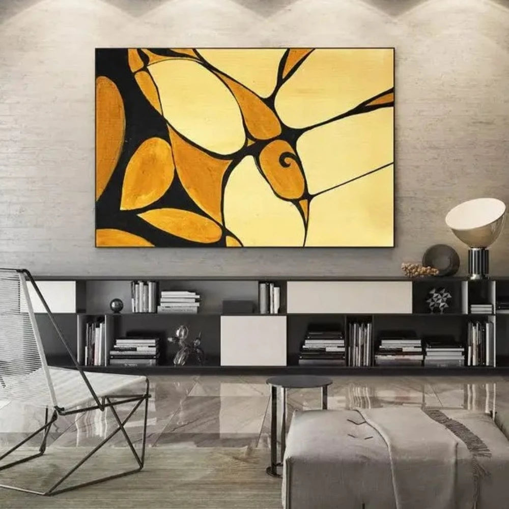 Room mockup showing curved yellow and ochre shapes divided by bold black lines with a small spiral motif.