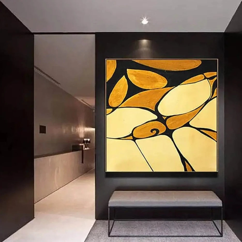 Room mockup showing curved yellow and ochre shapes divided by bold black lines with a small spiral motif.